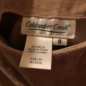 Tan, long genuine suede skirt.